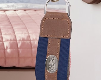 Ole Miss Rebels Collegiate Grosgrain Ribbon Key Chain with Leather Accent and Silver Emblem.