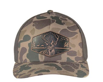 Buck Old School Camo Trucker Hat. Hand Burnished Full Grain Leather Patch. 5-Panel Richardson 112 Snapback Cap. Stitched Deer Leather Patch.