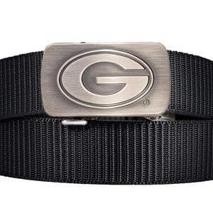May include: Black nylon belt with a silver-colored buckle. The buckle features a large, oval-shaped letter "G" in the center. The belt is made of a durable, woven material.