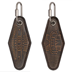 May include: Brown leather keychain with a Mississippi State University logo and the text "Mississippi State University, Est. 1878, Bulldogs".