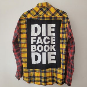 May include: A yellow and black plaid flannel shirt with a black patch on the back that says "DIE FACE BOOK DIE".