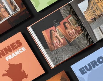 May include: A collection of travel photo books with colorful covers. The covers feature images of a woman, a city street, and a map of France. The text on the covers reads "Cannes France" and "Europe 2K".