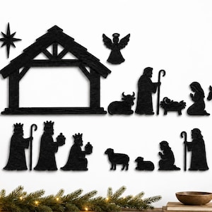May include: A black silhouette nativity scene wall decor set featuring a stable, a star, an angel, and figures including Joseph, Mary, the infant Jesus, three wise men, a donkey, a cow, and two sheep, all arranged in a decorative display.