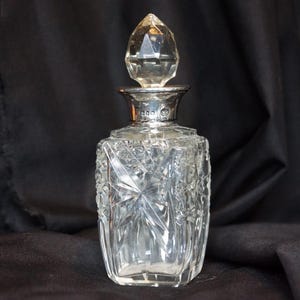 Crystal perfume bottle with silver collar dating from 1907/8