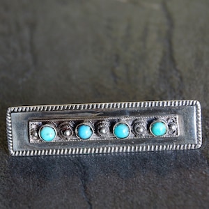 Vintage silver and blue stone brooch