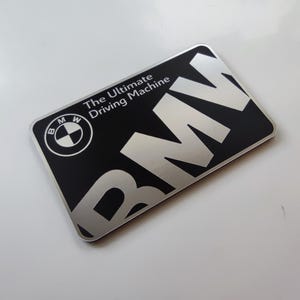 BMW Sticker The ultimate driving machine bmw silver color on black plastic label self-adhesive high quality