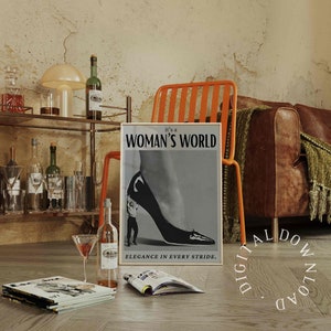 May include: A black and white poster with a woman's leg wearing a high heel shoe. A small man is holding onto the heel of the shoe. The poster has the text "it's a WOMAN'S WORLD" and "ELEGANCE IN EVERY STRIDE."