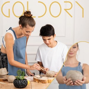 May include: Two people are working with clay. One person is shaping a bowl with a wooden tool, while the other person is holding a ball of clay. The background is white with the word "GOLDORY" in gold letters.