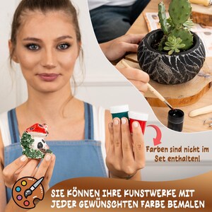 May include: A woman is holding a small ceramic mushroom figurine. The figurine is painted with green and red paint. The woman is also holding two small bottles of paint, one green and one red. The text on the image reads "Farben sind nicht im Set enthalten!" which translates to "Colors are not included in the set!"  The text below the image reads "SIE K&Ouml;NNEN IHRE KUNSTWERKE MIT JEDER GEW&Uuml;NSCHTEN FARBE BEMALEN" which translates to "YOU CAN PAINT YOUR ARTWORKS WITH ANY DESIRED COLOR".