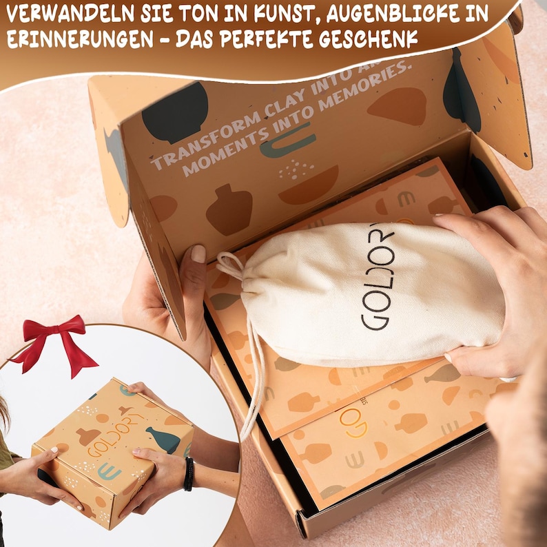 May include: A brown cardboard box with a white fabric bag inside. The box has a colorful design with the text "Transform clay into a moments into memories." The bag has the text "Goldor" printed on it.