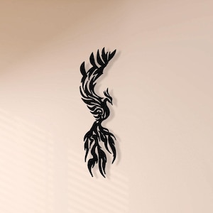 May include: Black metal wall art featuring a stylized phoenix design. The phoenix is depicted with its wings spread and its tail feathers flowing behind it.
