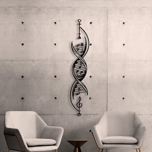 May include: A black metal wall sculpture in the shape of a double helix with musical notes and a treble clef. The sculpture is hanging on a gray concrete wall. Two white chairs with gold frames are in front of the sculpture, and a small gold side table is between the chairs.