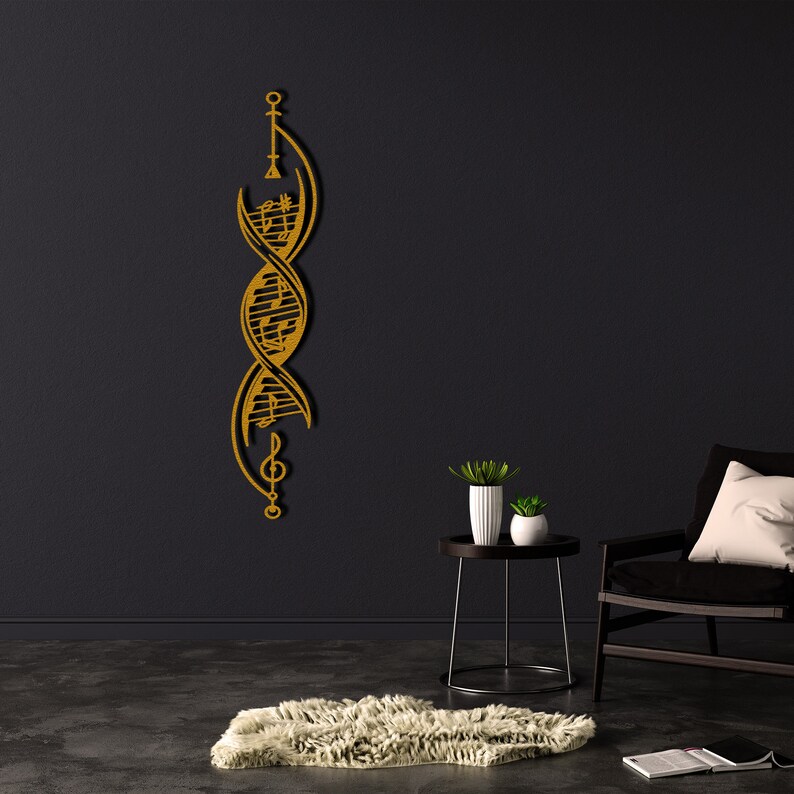 May include: A gold metal wall decoration in the shape of a double helix with musical notes and symbols. The decoration is mounted on a black wall in a room with a chair and a side table.