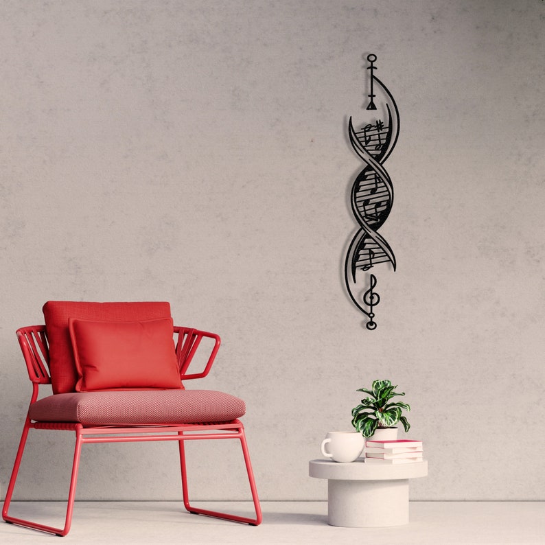 May include: Black metal wall art featuring a treble clef and musical notes intertwined in a spiral design. The art is mounted on a grey wall, with a red chair and a small table with a plant and books in the foreground.