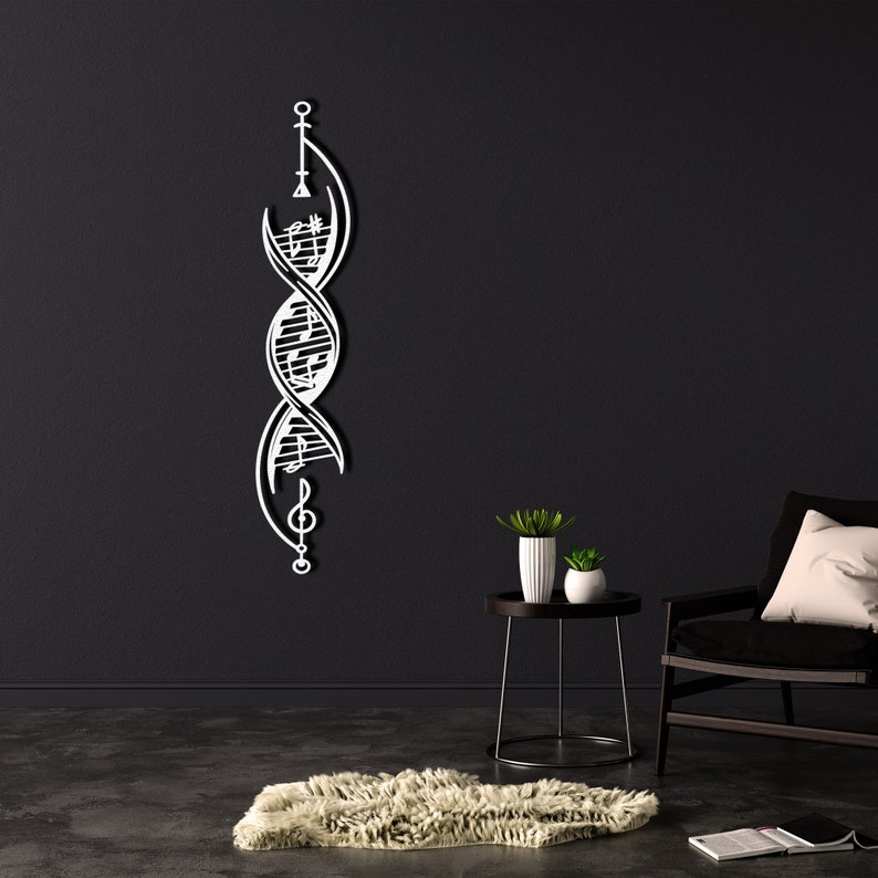 May include: A white metal wall decoration featuring a stylised DNA double helix with musical notes incorporated into the design. The decoration is mounted on a black wall in a room with a black armchair and a small side table with two potted plants.