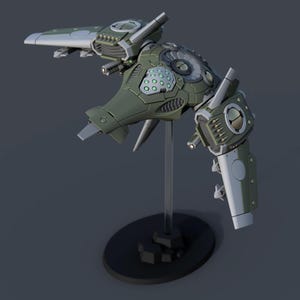 Puede incluir: Un modelo detallado de una nave espacial futurista en tonos verdes y grises, montado sobre un soporte negro. La nave espacial presenta intrincados detalles mecánicos, incluyendo múltiples alas, luces y un elemento de diseño circular. El modelo está sobre un fondo gris oscuro.