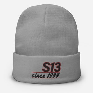 May include: Gray beanie with black embroidered text that reads "S13 since 1999" in red.