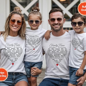 May include: Four people wearing white t-shirts with the words "Family Name" in script. The shirts have a heart-shaped design filled with family member names. A red heart is at the bottom of the design. The shirts are for a family.