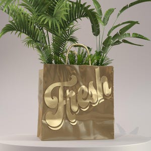 Puede incluir: Una bolsa de papel dorada con la palabra "Fresh" impresa en letras doradas. La bolsa está llena de plantas verdes.