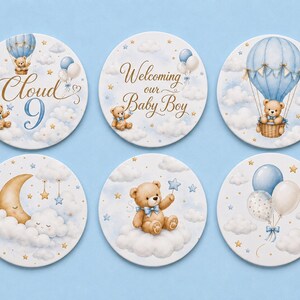 May include: Six circular coasters featuring illustrations of teddy bears, hot air balloons, clouds, and stars in shades of blue, white, and gold. One coaster displays the text Cloud 9, and another displays the text Welcoming our Baby Boy.