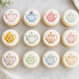 May include: A set of twelve round cupcakes, each topped with a circular edible topper featuring a unique illustration of a teapot. The designs include various colors and patterns such as polka dots, stripes, floral motifs, and bows on a white background.