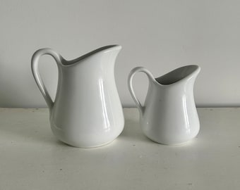 set of two vintage French white porcelain milk jugs creamers