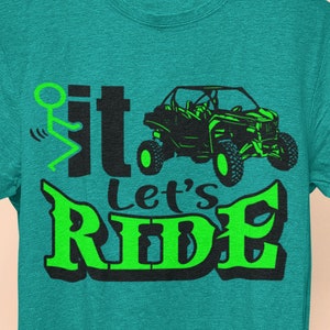 May include: A green and black t-shirt with the text "Sit, Let's Ride" and a stick figure riding a green off-road vehicle.