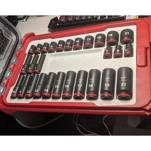 May include: A red and black tool case with a foam insert containing a set of 12 black socket wrenches. The wrenches are labelled with numbers from 10 to 21.
