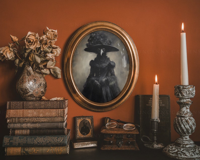 May include: An oval framed portrait of a figure in a black dress and hat with a bird-like mask. The portrait is surrounded by antique books, candles, and a decorative vase with dried flowers. The scene is set against a warm, orange-toned wall.