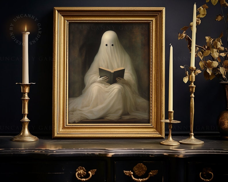 May include: A framed artwork depicts a ghost reading a book, with a gold frame. The ghost is draped in white fabric. The artwork is flanked by lit candles in gold candle holders. The text "UNCANNY GARDENS" is visible.