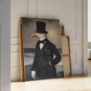 May include: A framed painting of a seagull wearing a top hat and bow tie, with a dark background and a glimpse of a beach in the distance.