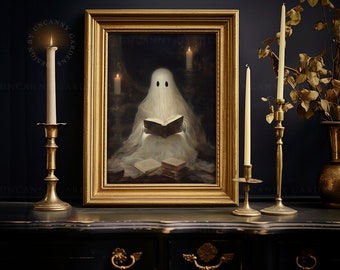 May include: A framed painting of a white ghost reading a book in a dimly lit room with candles. The painting is in a gold frame and is on a black surface with two gold candle holders.