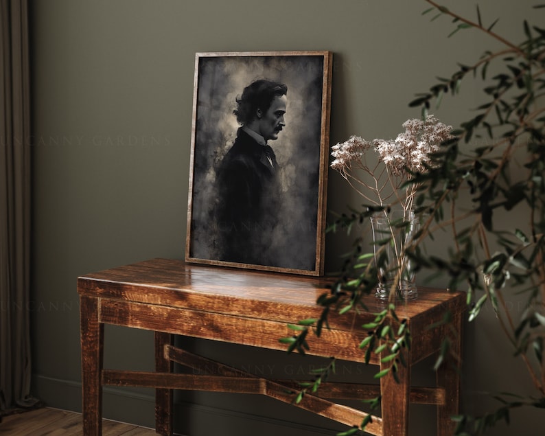 May include: A framed black and white portrait of a man with a mustache, wearing a dark suit and tie. The portrait is set against a textured background with a faded, vintage look. The frame is brown wood.