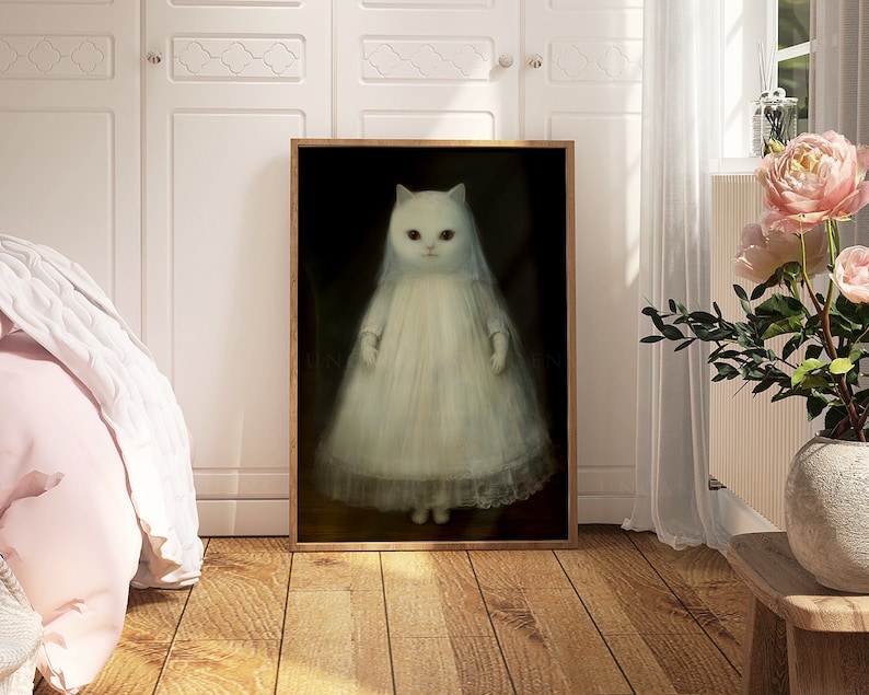 May include: A framed painting of a white cat wearing a white bridal veil and dress. The cat has red eyes and is standing on a dark background.