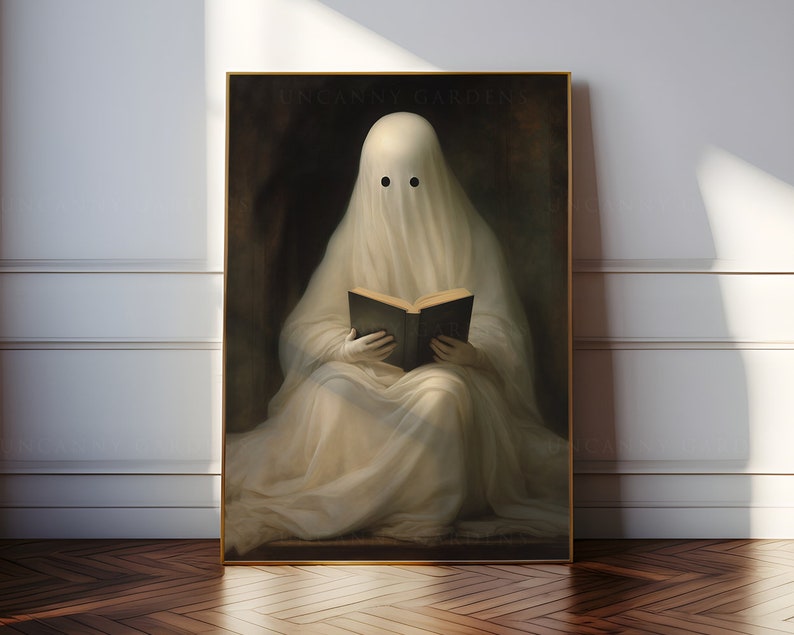 May include: A framed print featuring a ghost draped in white fabric, reading a book. The ghost has two black eyes and is set against a dark background. The words "UNCANNY GARDENS" are printed at the top of the print.