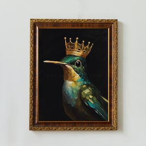 May include: A framed painting of a hummingbird wearing a gold crown. The hummingbird is green and blue with a black background. The painting is framed in a gold ornate frame.