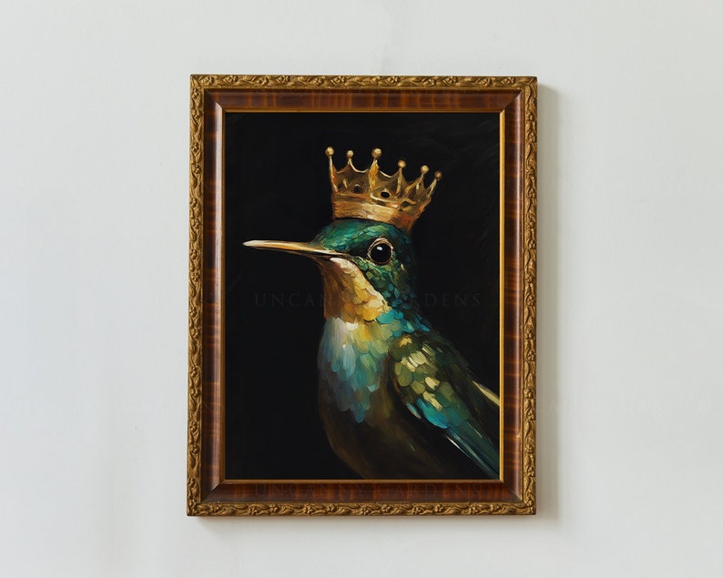 May include: A framed painting of a hummingbird wearing a gold crown. The hummingbird is green and blue with a black background. The painting is framed in a gold ornate frame.