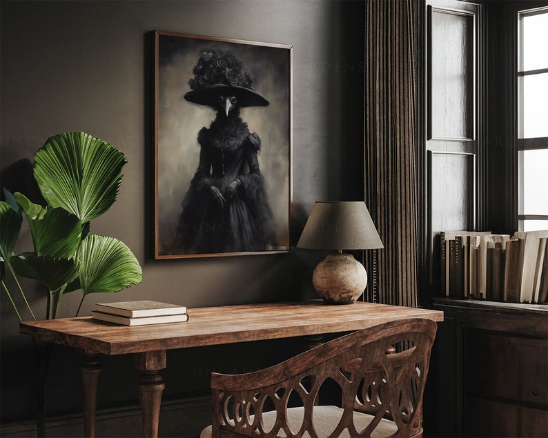 May include: A framed artwork depicts a figure in a black plague doctor costume with a wide-brimmed hat adorned with roses. The artwork hangs above a wooden desk with a lamp and books, creating a gothic and vintage aesthetic.