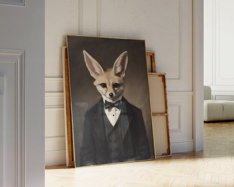 May include: A framed portrait of a fennec fox in a black tuxedo with a bow tie. The artwork has a dark background and a gold frame. The fox has large ears and a sophisticated expression.