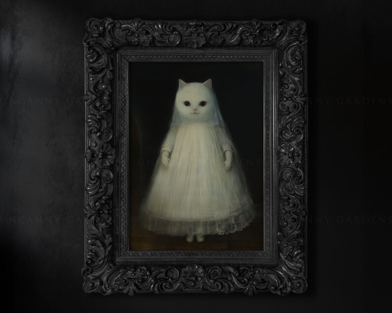 May include: A white cat wearing a white dress with lace trim, painted in a realistic style, in a black ornate frame.