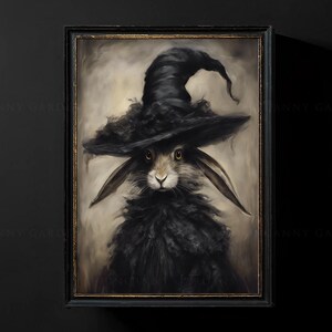 May include: A black rabbit wearing a black witch's hat with a wide brim. The rabbit has a fluffy black coat and large, dark eyes. The background is a soft, light brown.