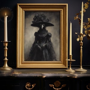 May include: A framed portrait of a figure in a black dress and a plague doctor mask, adorned with a hat of roses. The artwork is in a gold frame, set on a black surface, flanked by brass candle holders with lit candles. The overall aesthetic is gothic.