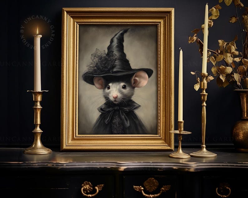 May include: A painting of a mouse dressed as a witch wearing a black hat and a black dress with a white lace collar. The painting is framed in gold and set against a dark background.