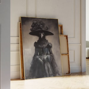 May include: A framed black and white portrait of a bird-like figure in a Victorian-era dress and hat adorned with roses. The artwork has a vintage aesthetic, with a gold frame and a soft, blurred background. The figure has a beak and is wearing a wide-brimmed hat.