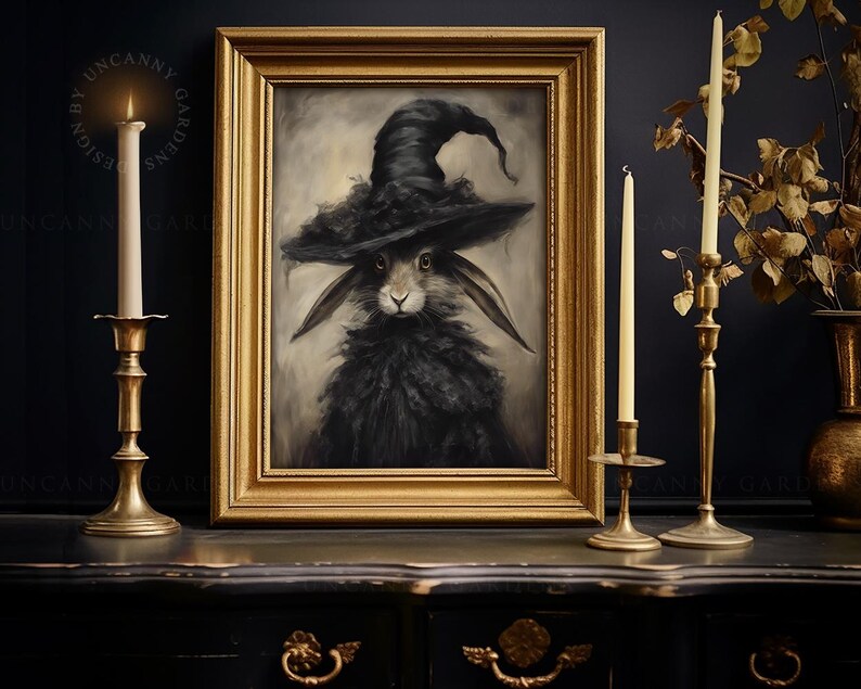 May include: A framed painting of a black rabbit wearing a witch's hat. The rabbit has a serious expression and is looking directly at the viewer. The painting is set against a dark background.