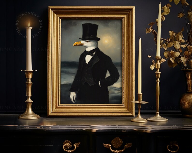 May include: A framed painting of a seagull wearing a top hat and a tuxedo, standing in front of a seascape. The painting is in a gold frame and is hanging on a dark blue wall.
