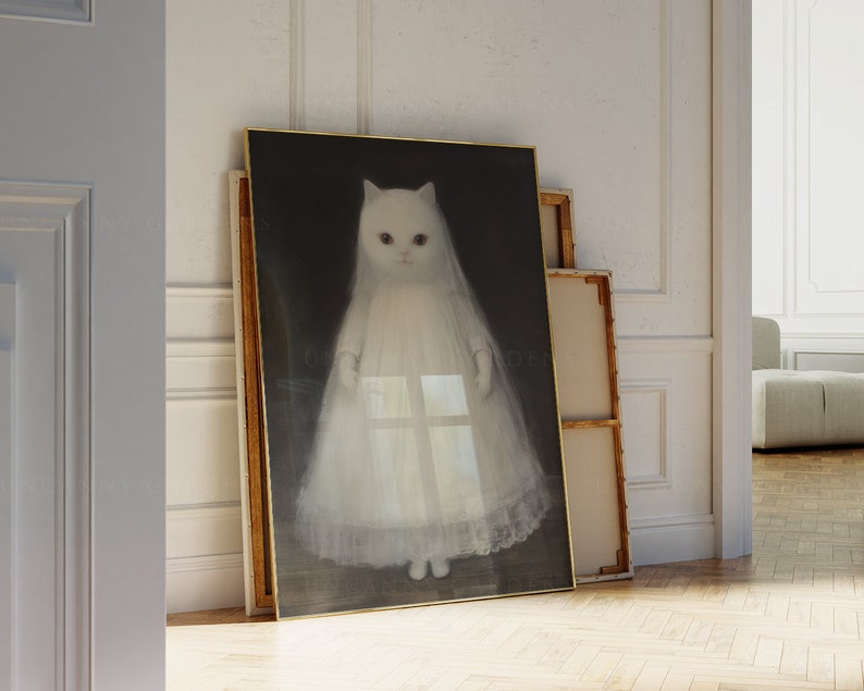 May include: A framed print of a white cat wearing a white dress, standing against a dark background.