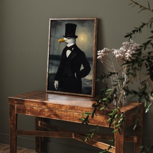 May include: A framed painting of a seagull wearing a top hat and a tuxedo. The seagull is standing in front of a dark background with a faint light behind it. The painting is on a wooden table with a vase of white flowers in the foreground.