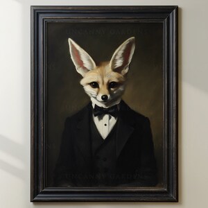 May include: A framed portrait of a fennec fox in a black tuxedo with a bow tie. The fox has large ears and a serious expression. The artwork is set against a dark background and framed in a black, distressed wooden frame. The text "UNCANNY GARDENS" is visible.
