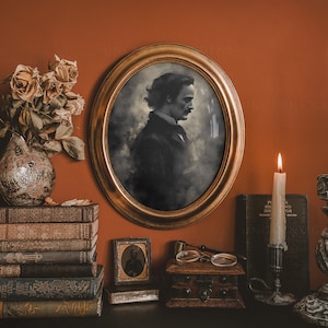 May include: A vintage-style portrait of a man in a gold frame, with a vase of dried flowers and two candlesticks with lit candles on a dark wooden shelf. The candlesticks are made of white painted wood with a distressed finish. The shelf is decorated with books and a small wooden box.